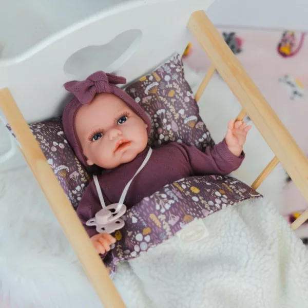 Реалистична кукла бебе Тонета в лилаво легло с дървена рамка Antonio Juan