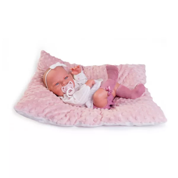 Бебе Леа с биберон и бяла блузка на мека розова възглавница с релефна текстура