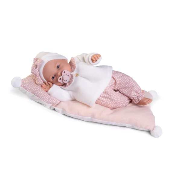 Плачещо бебенце Бимба легнало на розовата си възглавница с биберонка