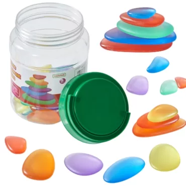 Светещи сензорни камъчета за учене и игра Masterkidz разпръснати на маса