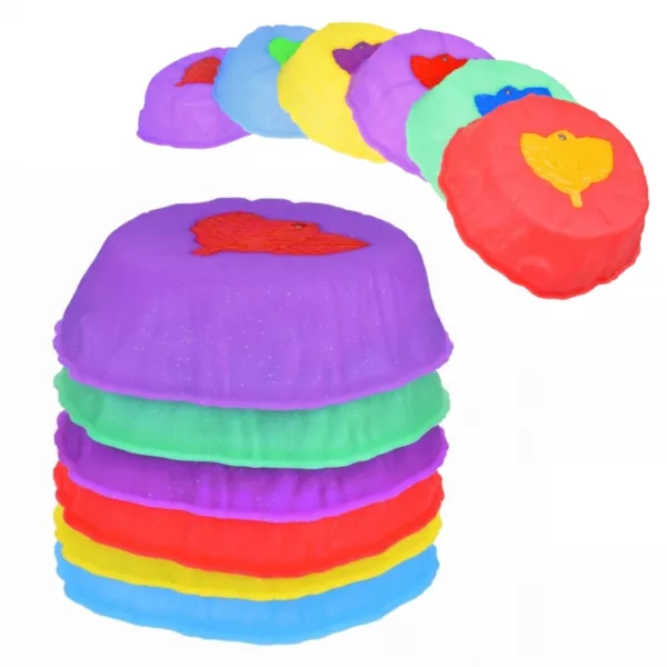 Светещи сензорни камъни за баланс и игра, подредени на цветни купчини